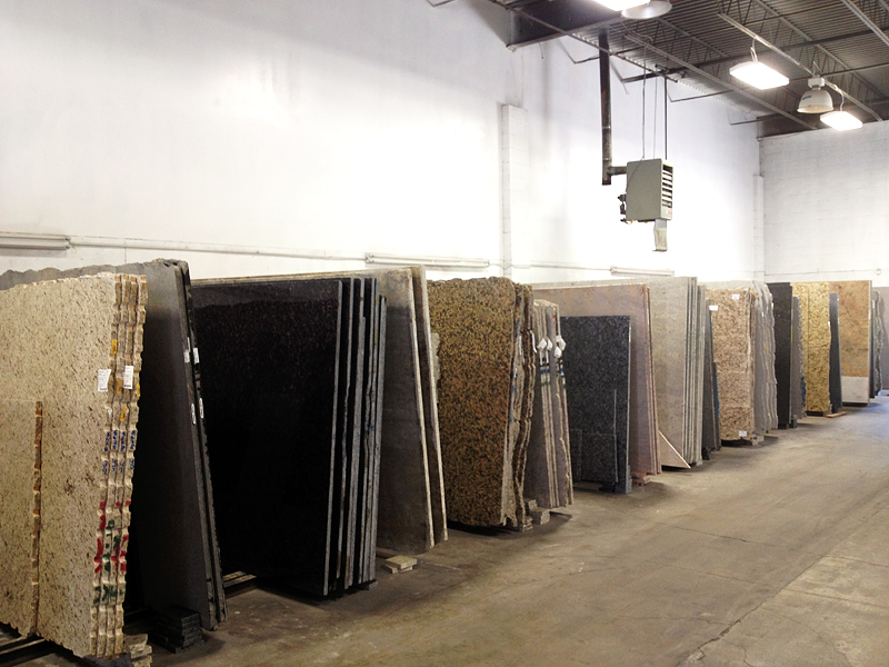 Polished Granite Floor Slabs Stacked In Warehouse Stock Photo